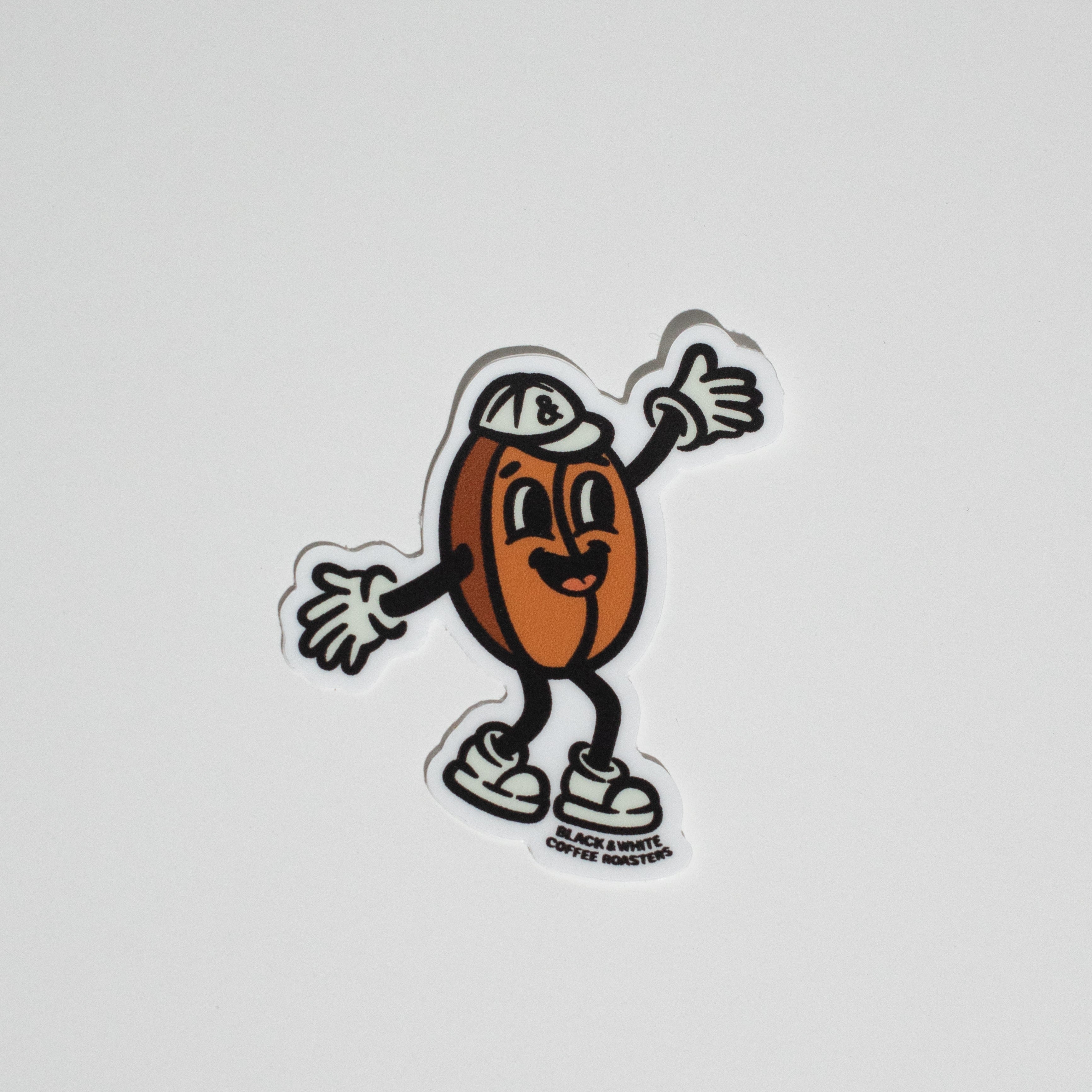 B&W Dancing Bean Sticker by Sage Pizza, featuring a whimsical bean character in motion, designed in a 2 x 2 format.