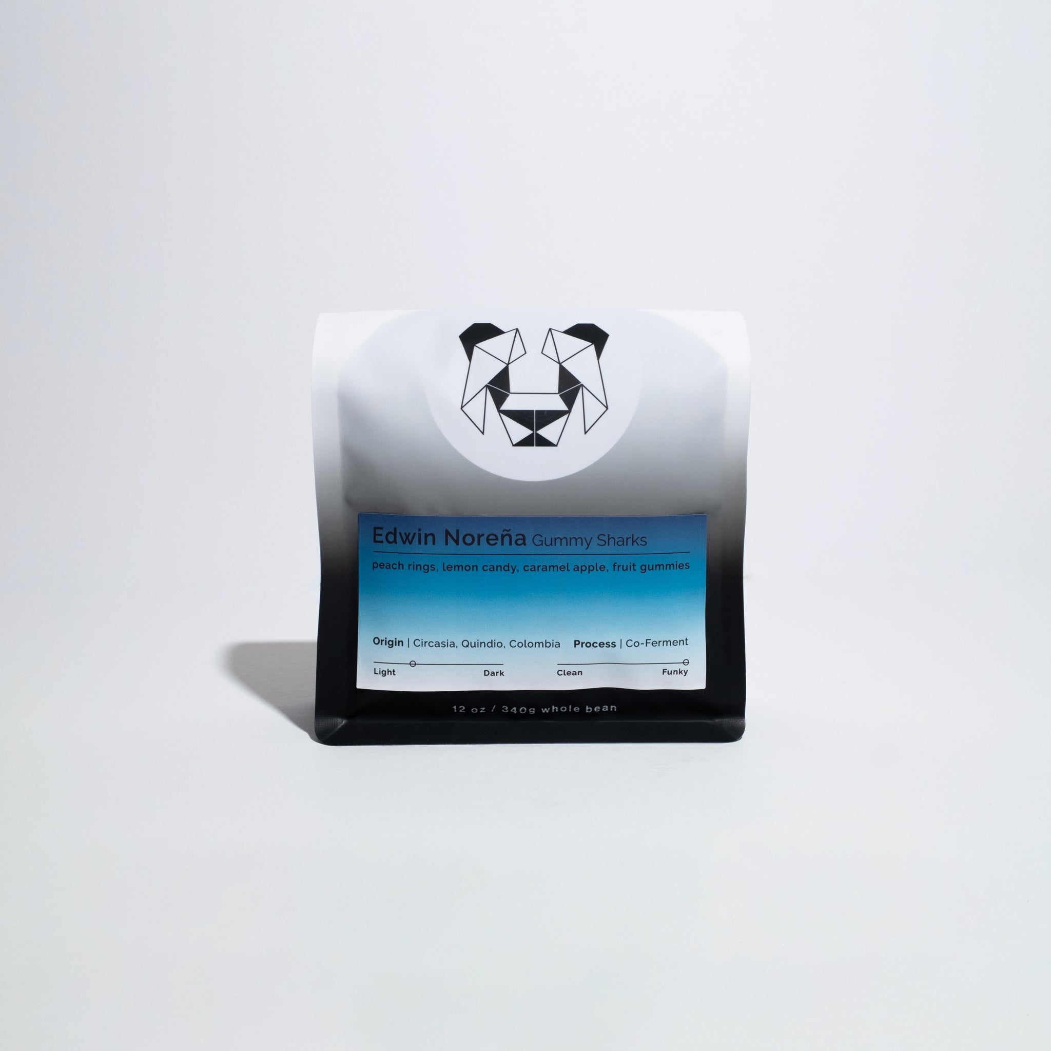 Edwin Noreña - Gummy Sharks coffee bag, showcasing a blend of green apple and berry co-fermented beans from Colombia, emphasizing unique fermentation techniques and intense flavors.