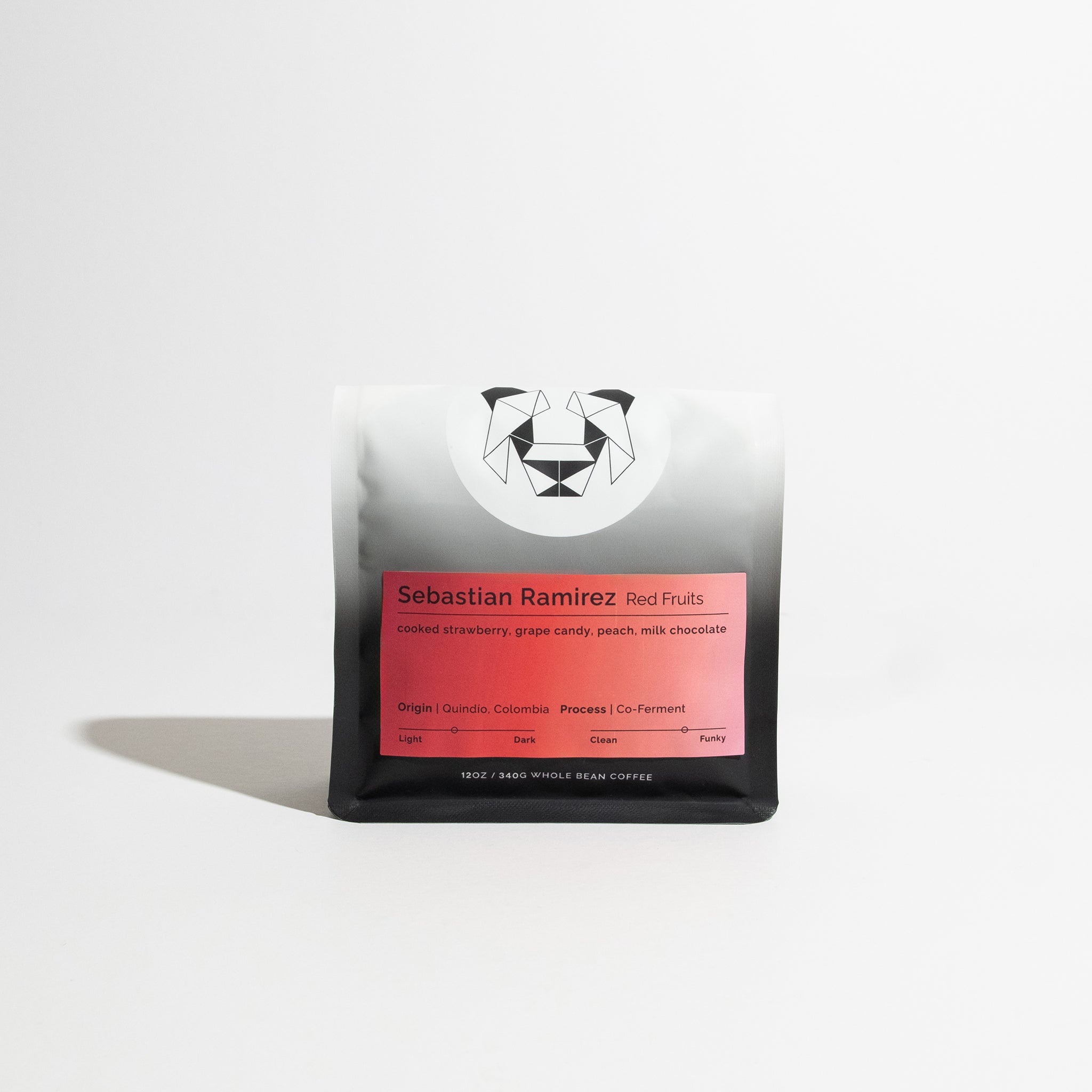 Bag of Sebastian Ramirez - Red Fruit whole-bean coffee, featuring a geometric panda logo and a label with tasting notes, origin, and process details.