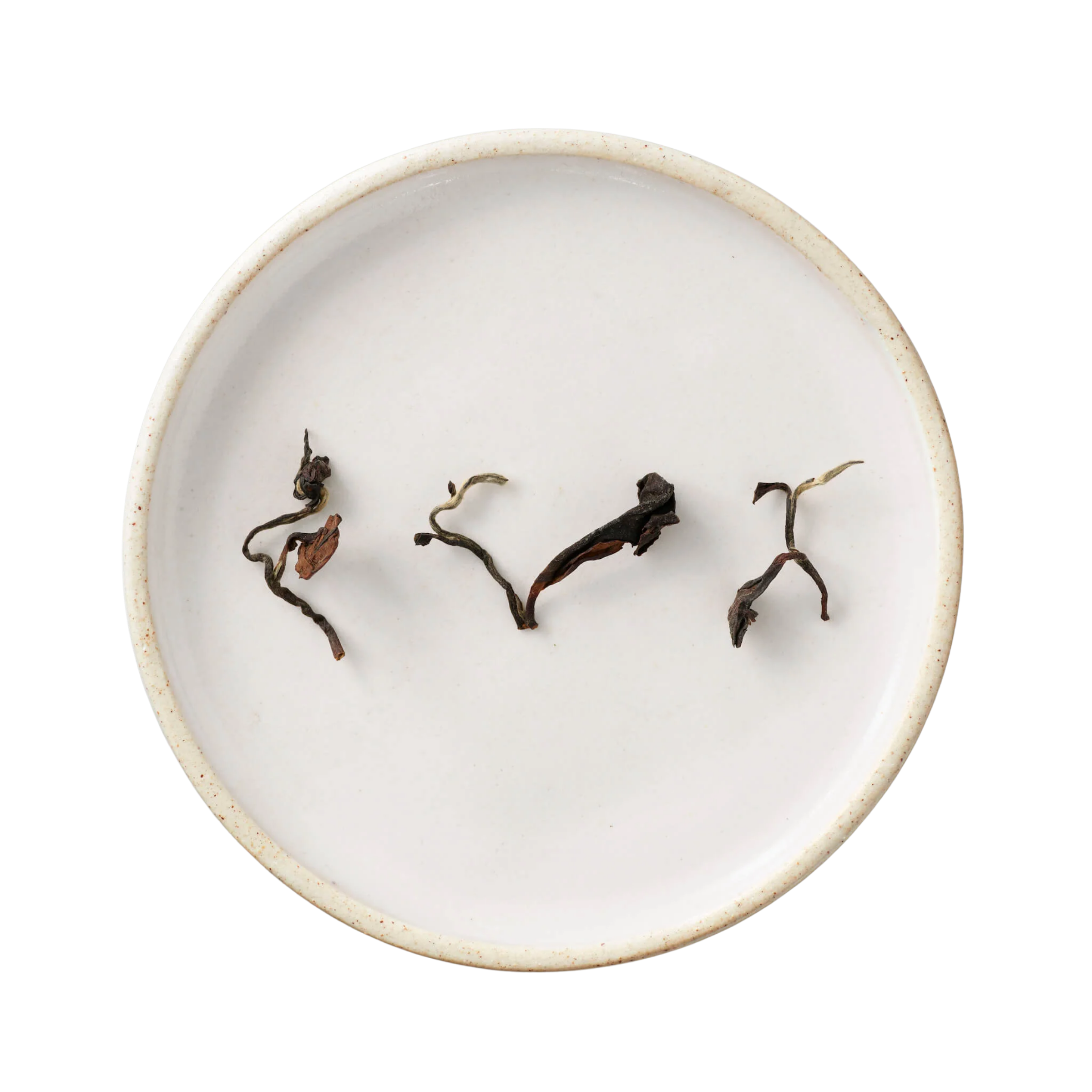 Champagne Long Kou Oolong: A white ceramic dish holds twisted, dark-brown dried leaves of Eastern Beauty tea, showcasing its rich, layered aroma.