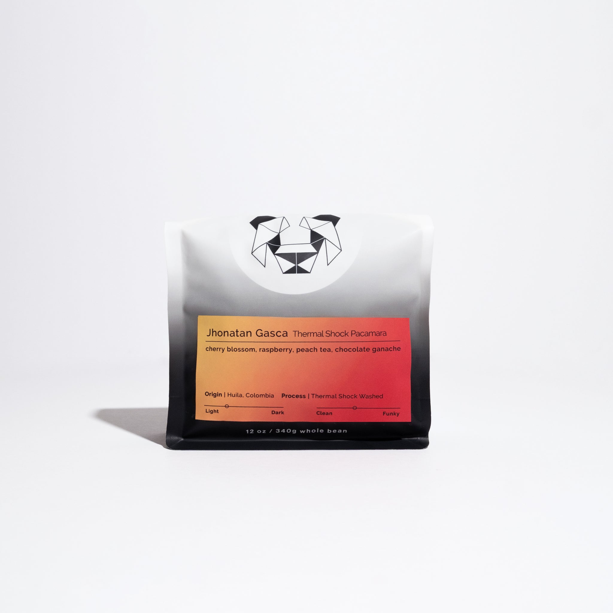Sealed 12 oz bag of specialty whole-bean coffee, Jhonatan Gasca Thermal Shock Pacamara, featuring cherry blossom, raspberry, peach tea, and chocolate ganache tasting notes.